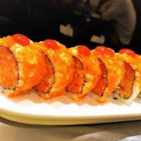 Volcano Roll · 8 pieces. Spicy yellowtail, spicy tuna and spicy salmon inside, tobiko and chili sauce on top.