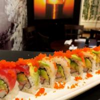 Rainbow Roll · Snow crab, cucumber inside, topped with salmon, tuna, white fish and tobiko.