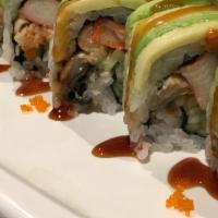 Dragon Roll · Eel, cucumber, snow crab, inside topped avocado, tobiko and eel sauce.