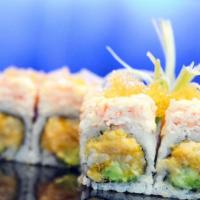 Snow White Roll · White tuna, spicy mayo, avocado, crunch inside, topped with snow crab and yellow tobiko.