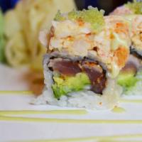Spicy Girl Roll · Pepper tuna, avocado, scallion inside, topped with lobster salad, wasabi tobiko and wasabi s...