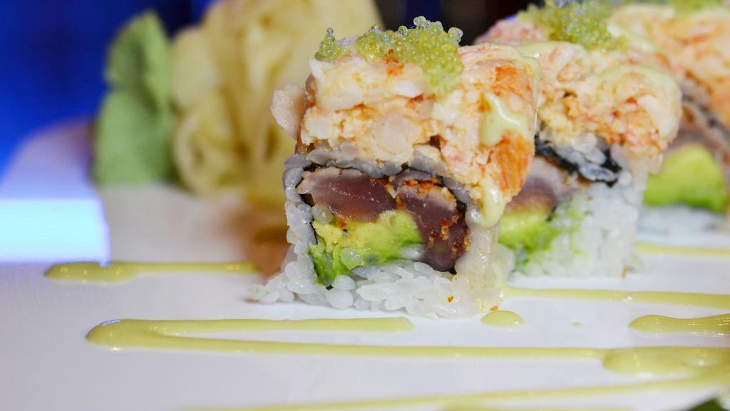 Spicy Girl Roll · Pepper tuna, avocado, scallion inside, topped with lobster salad, wasabi tobiko and wasabi sauce. Spicy.