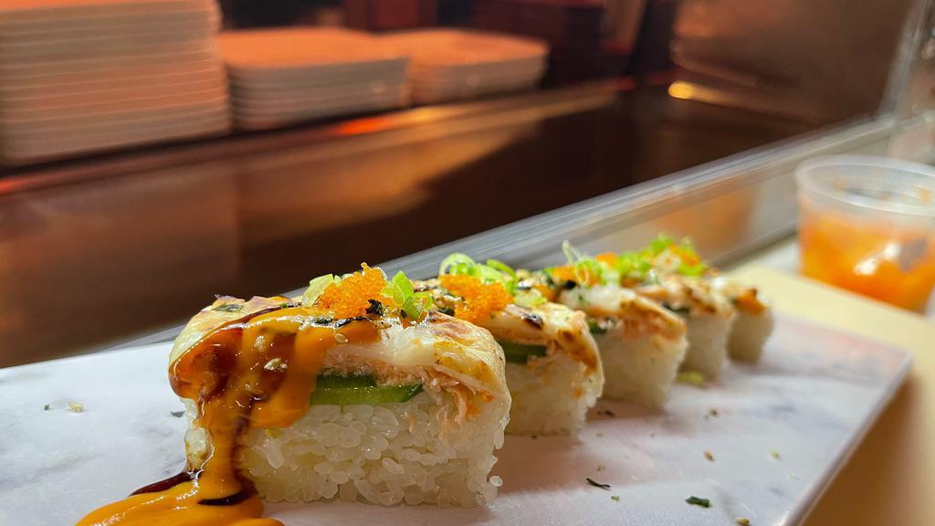 Mine Craft · Salmon, jalapeño, Spicy Crab on the bottom. With mozzarella cheese and spicy eel sauce and tobiko.