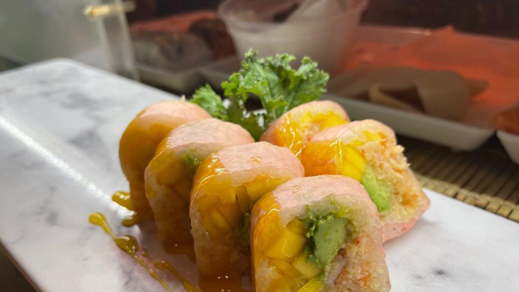 Butterfly Roll · Soy paper with lobster salad, avocado, mango, crunch, mango sauce.