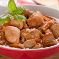 Pollo Guisado · Bone in chicken stew with carrots and potatoes