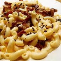 Loaded Bacon Macaroni · Bacon on top of noodles with housemade cheese sauce.