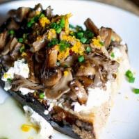 Mushroom Toast · roasted and pickled wild mushrooms, Vermont Creamery Bijou, honey, orange zest, thyme