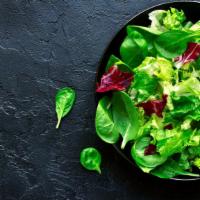 Romaine Leaf Salad · Fresh salad with vegetables and a choice of dressing.
