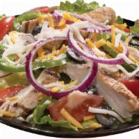 Tuscan Grilled Chicken · Grilled chicken with fresh greens, red onions, green peppers, black olives and tomatoes. Spr...