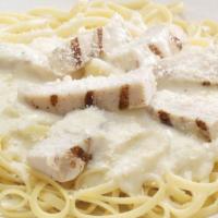 Chicken Alfredo Pasta · A bed of pasta and grilled chicken strips smothered in alfredo sauce and finished with Pecor...