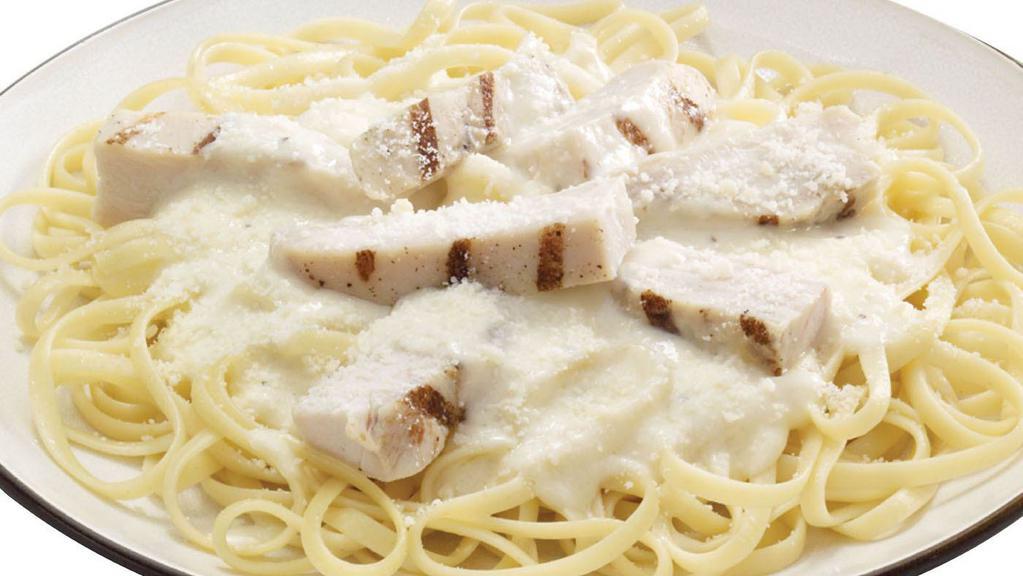 Chicken Alfredo · A bed of pasta and grilled chicken strips in alfredo sauce and finished with Pecorino Romano cheese.