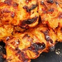 Char Grilled Chicken Tikka · Boneless chicken marinated in yogurt and spices, then roasted in a clay oven