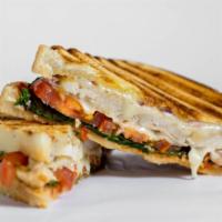 Chicken Fajita Panini · Grilled chicken, topped with cheddar cheese, roasted peppers, caramelized onions and salsa. ...