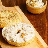 Fresh Bagel With Walnut & Raisin Cream Cheese · Customer's choice of Bagel, served toasted with a side of Walnut & Raisin Cream cheese.