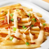 Cheese Fries · Golden-crispy fries salted to perfection. Topped with melted cheese.
