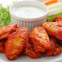Buffalo Wings · 5 pieces of chicken wings breaded and fried to perfection. Topped with buffalo sauce.
