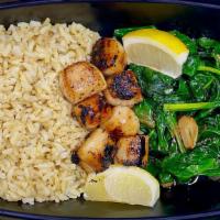 Seared Scallops · Served with sautéed spinach and brown rice.