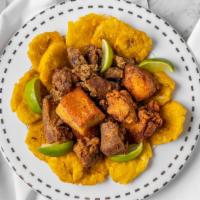 Carne Guisado · Beef Stew
Served with  rice and  beans, yellow or green fried plantains, or green salad (ser...