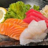 Sashimi · 7 pieces. 2 tuna, 2 salmon, 2 fluke, 1 seabass