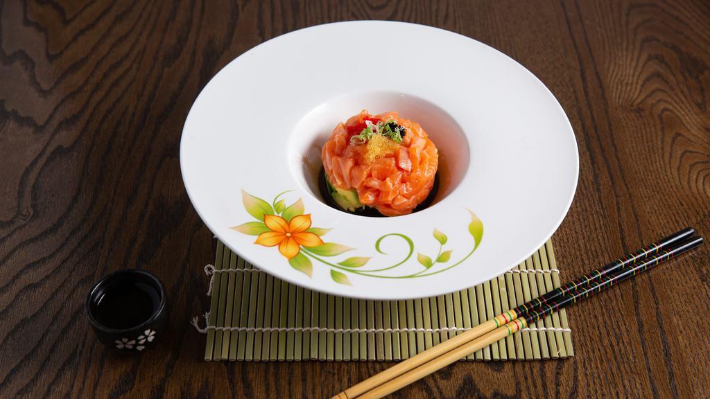 Salmon Tartar · Marinated with spicy sauce, soy sauce and sesame oil topped with caviar.