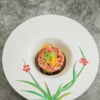 Tuna Tartar · Marinated with spicy sauce, soy sauce and sesame oil topped with caviar.