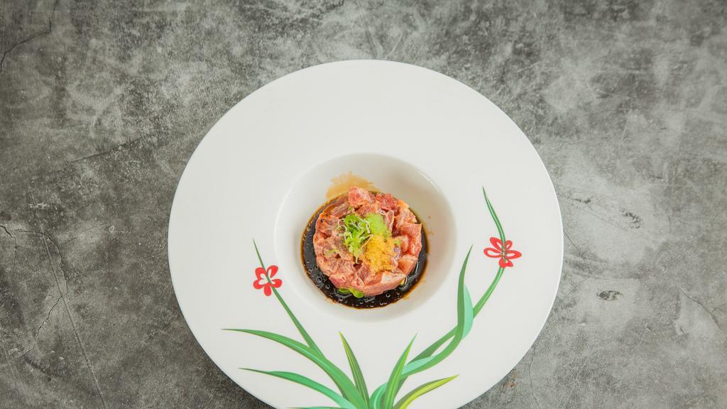 Tuna Tartar · Marinated with spicy sauce, soy sauce and sesame oil topped with caviar.