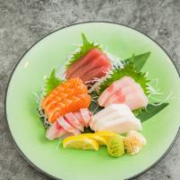Sashimi Deluxe · 18 pieces sashimi. with 3 tuna, 3 salmon , 3 fluke, 3 seabass, 3 white tuna .and 3 yellowtai...