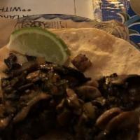 Hongos Tacos · Soft corn tortilla - cilantro and sweet onion. Mushrooms, shallots, epazote.