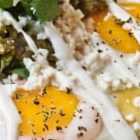 Huevos Rancheros Verdes · Two eggs atop crisp corn tortillas, black beans, green tomatillo salsas crema, queso fresco ...