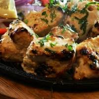 Chicken Malai Kabab · Tender boneless breast cubes marinated in almond yogurt paste overnight, cooked gently and s...