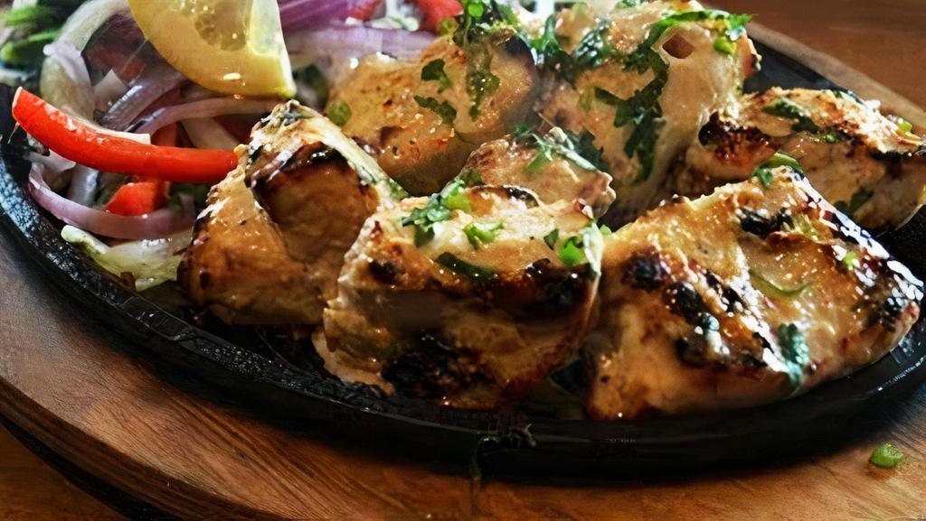 Chicken Malai Kabab · Tender boneless breast cubes marinated in almond yogurt paste overnight, cooked gently and skewers.