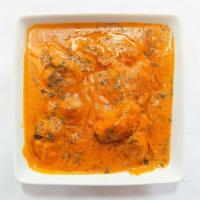 Chicken Tikka Masala · Chicken tikkas cooked with sauteed red onion and bell peppers in a tasty tomato masala sauce.