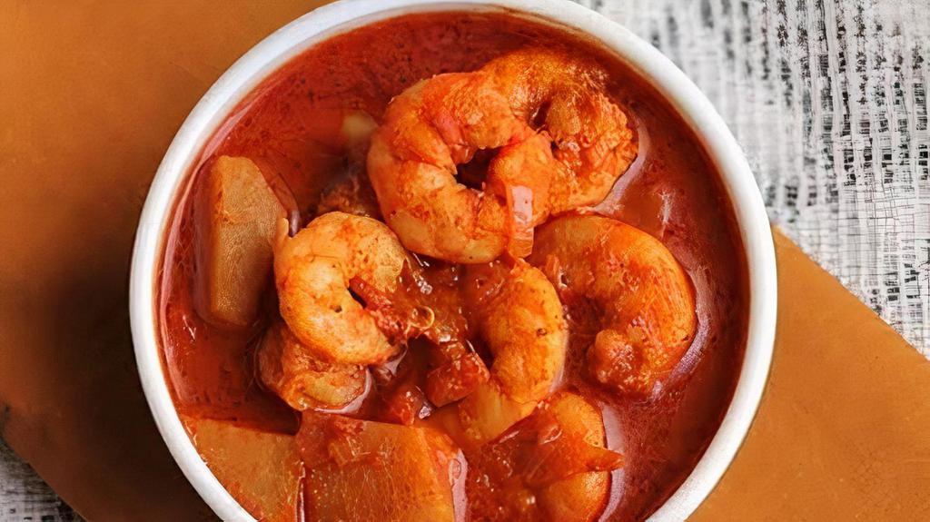 Shrimp Masala · Tiger shrimp simmered in Bombay style, onion, tomato and home ground spices.