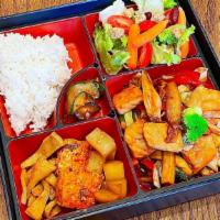 Salmon Teriyaki Bento Box · Rice, Salmon, and side dishes.