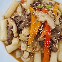 Sweet Soy Rice Cake · Gungjung Tteokbokki, made of rice cakes, beef, cabbage, scallions, and fried dumplings with ...
