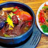 Galbi Jjim & Japchae Combo · Braised beef short ribs and stir-fried glass noodles with vegetables and meat.