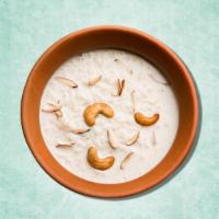 Aromatic Rice Pudding · Simple rice cooked in sweetened milk with add-ins like ground cinnamon or raisins.