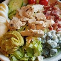 *Chicken Cobb Salad · grilled chicken, salad greens, cucumbers, tomatoes, bacon, crumbled bleu, sliced egg, guacam...
