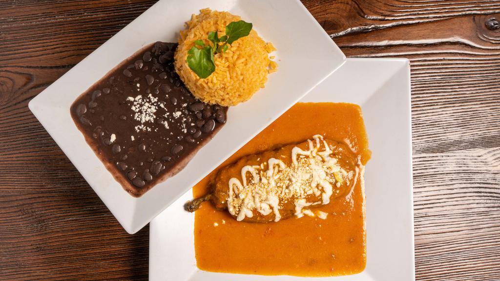 Chiles Rellenos · Stuffed poblanos peppers with cheese. Served with rice and beans.