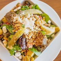 Mediterranean Salad · Mixed greens with tomatoes, walnuts, cucumbers, artichokes, onions, corn, green peppers, fet...