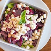 Beet Salad · Roasted red beets tossed with feta cheese, mixed greens, olive oil and lemon juice.