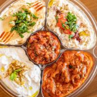Mixed Appetizer Platter · Classic hummus, Baba Ganoush, sauced eggplant, spicy ezme and lebni.