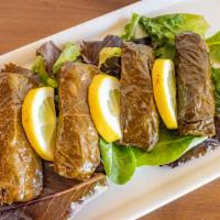 Stuffed Grape Leaves · Four grape leaves hand-rolled in our kitchen with pine nuts, currants, rice and fresh herbs.