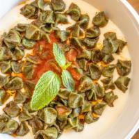 Turkish Dumplings · Small ravioli-like dumplings handmade in our kitchen stuffed with beef and onions and served...