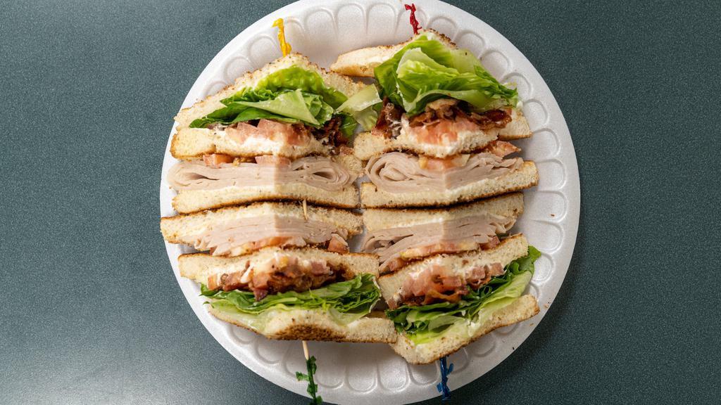 Turkey Club Sandwich · Turkey, bacon, with lettuce, tomato, and mayo on toast.......
