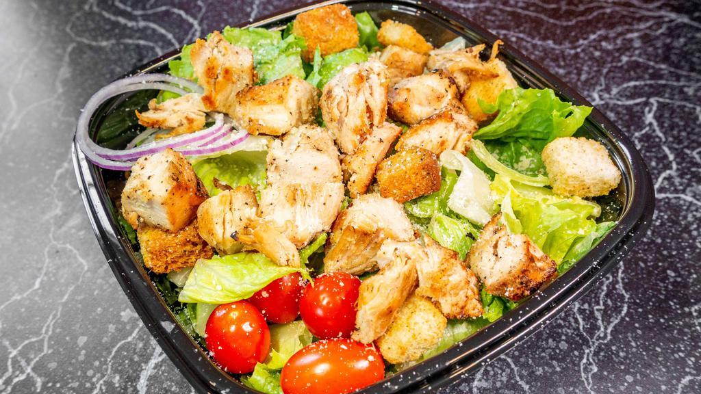 Chicken Caesar Salad · Crisp romaine lettuce tossed in Caesar dressing topped with chicken.