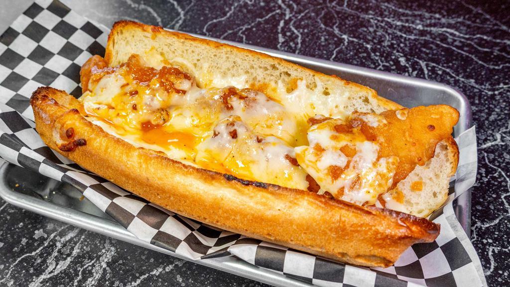 Buffalo Chicken Melt Sub · Crispy chicken in wing sauce, blue cheese, and mozzarella on a sub roll.