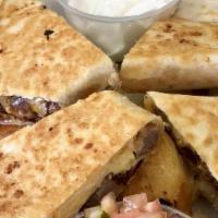Breakfast Quesadilla
 · Scrambled eggs. Bacon, sausage, cheddar jack cheese served with home fried potatoes sour cre...