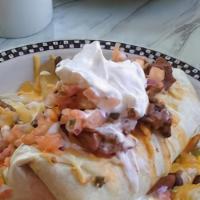 El Desayuno Burrito
 · Scrambled eggs, chorizo sausage, bacon, onions, peppers, jalapeños and cheddar jack cheese t...