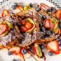 Chocolate Babka French Toast
 · Chocolate babka dipped in our french toast batter topped with kiwi, strawberries, blueberrie...